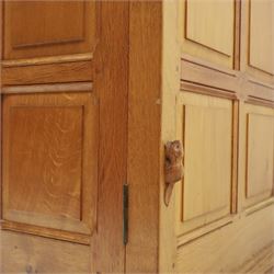 Beaverman - oak double wardrobe, enclosed by twin multi-panelled doors, Yorkshire Rose carved handles, the interior fitted with shelf and hanging rail, with signature carved beaver, by Colin Almack of Sutton, near Thirsk