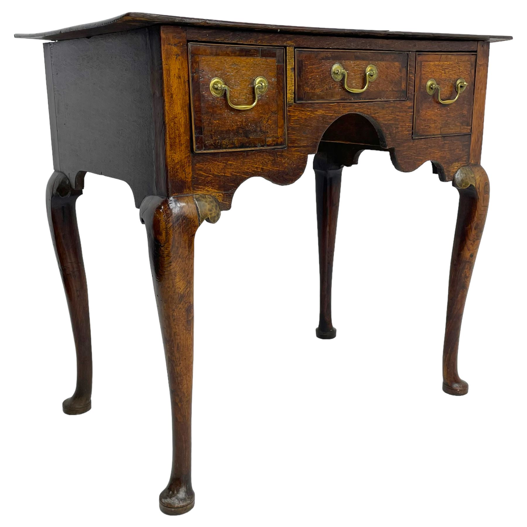 18th century oak low-boy, rectangular top over three crossbanded and cock-beaded drawers, ogee and stepped arch apron, on cabriole supports 