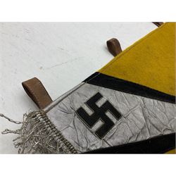 Two replica German Luftwaffe trumpet banners, one heavily silver wire embroidered with Luftwaffe eagle in a wreath, on an amber, white and black rayed background, , with silver wire tasselled border and four leather hanging loops, approx. 50 x 49cm; the other slightly larger heavily gold wire embroidered with the Luftwaffe eagle on a plain amber ground with gold wire tasselled border and two hanging loops (2)