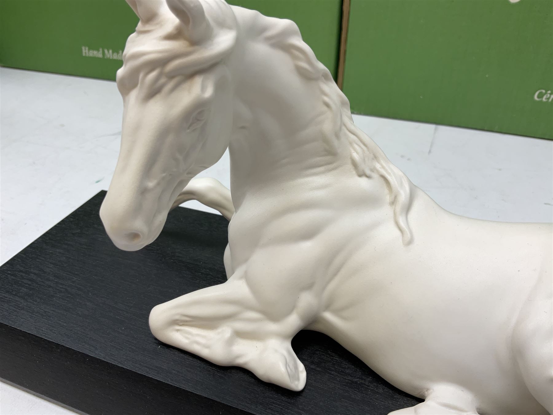 Five Beswick and Royal Doulton horse figures in matt white on black plinths, comprising of  Spirit of Affection no. 2689/2536, Springtime no.2837, Spirit of peace no.2916, Spirit of earth no.2914 and Spirit of the wild no. 183, together with a composite figure of a horse (6)