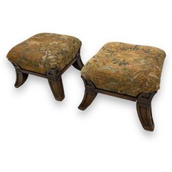 Pair of early 20th century miniature footstools, square seat covered in gold and orange floral patterned tapestry fabric, on carved wooden frame with splayed supports 