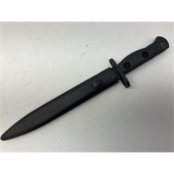 British Army L1A3 SLR Self Loading Rifle bayonet, with 20.5cm Bowie type fullered blade, hooked pommel with working push release button, grip secured by two deeply recessed rivets and marked L1A3 9600257 D71; in matching black scabbard L32.5cm overall