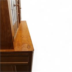 David 'Oakleafman' Langstaff - oak three drawer dresser, the scalloped cornice above a back with central open shelves flanked by two glazed and leaded cupboard doors opening to glass shelves, upon a base with adzed top carved with signature leaf, three drawers and three panelled cupboard doors with turned handles, upon octagonal feet, from the workshop of David Langstaff, Easingwold, Yorkshire