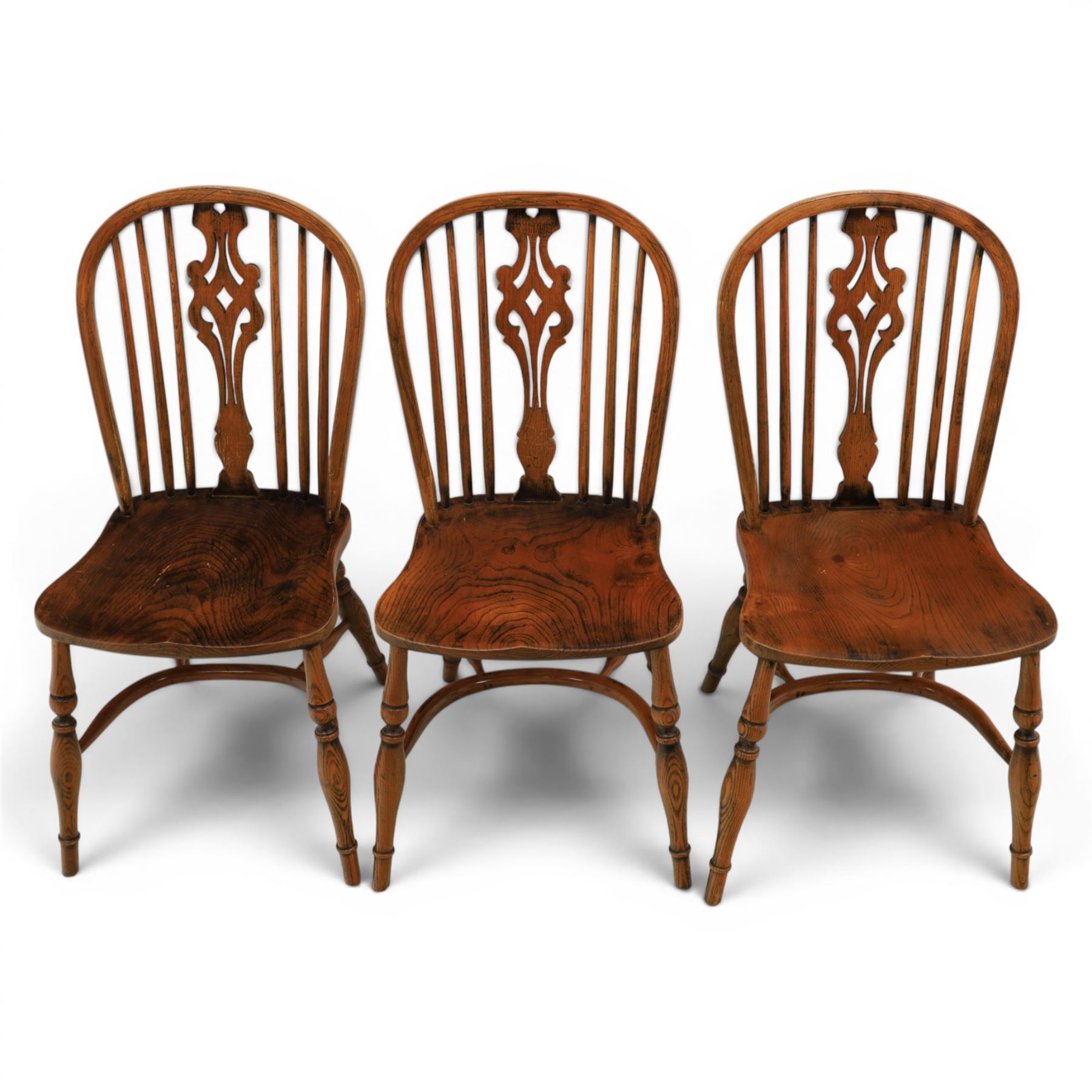 Set of six elm Windsor chairs, saddle seats with crinoline stretchers