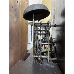 Thirty-hour oak cased longcase clock by  William Bancroft of Scarborough circa 1830, with a swan’s neck pediment, brass patera and three brass spire and ball finials, stepped break arch hood door flanked by plain pillars with brass capitals, trunk with a full length door and curved arch top, on a plain square plinth with bracket feet, painted break arch dial with roman numerals and quarter hour Arabic’s, date recorder (anti clockwise) and matching brass hands, arch painted with a rural scene depicting a ruined tower and cottage with depictions of flowers to the spandrels, dial pinned directly to a chain driven countwheel striking movement, striking the hours on a bell. With weight and pendulum. The Bancroft family were prodigious Scarborough clockmakers during the 18th and 19th century, William Bancroft is recorded as working in Newborough Street from 1820 onwards. 


