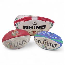 Three signed rugby balls, including 2017 Lions Tour Rhino Jumbo ball, signed by eight play...