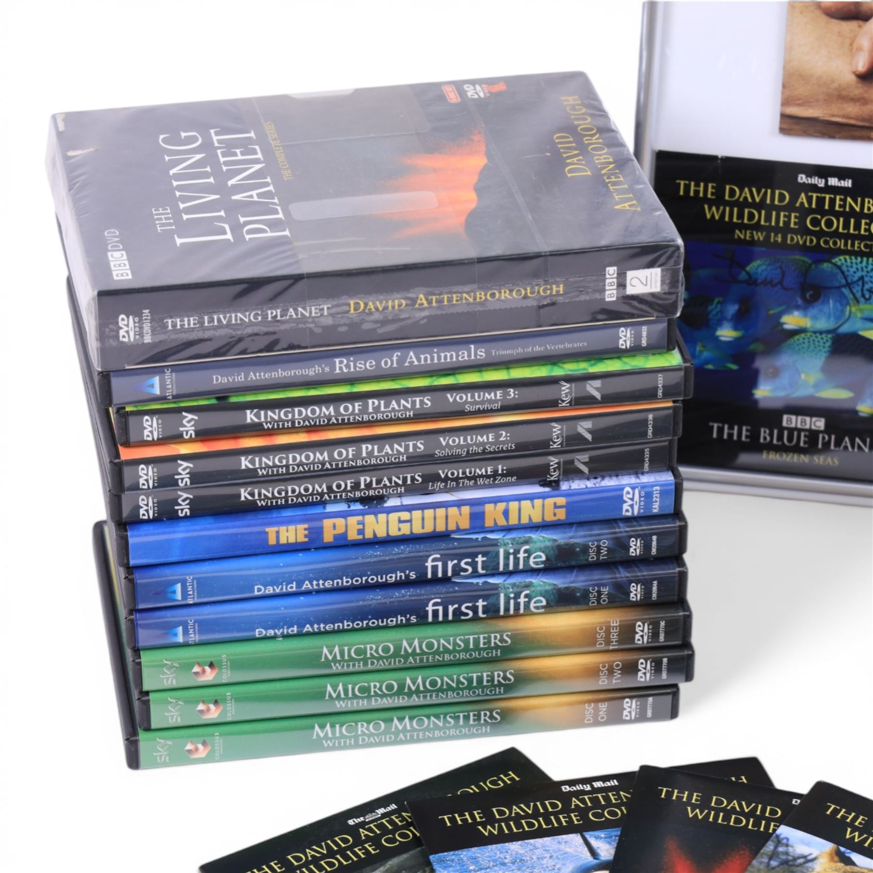 David Attenborough memorabilia, including framed montage of a Sunday Times Magazine cover and two DVD sleeves, one signed, books including first editions, DVDs and Audio CDs