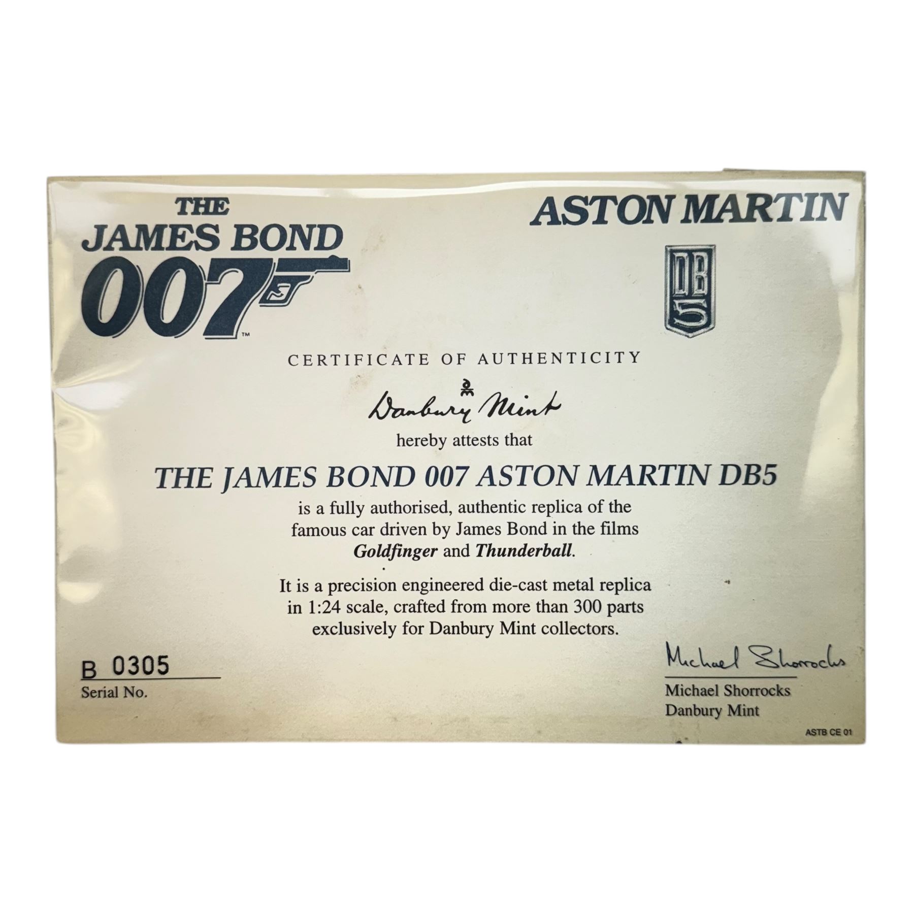 Danbury Mint James Bond 007 1:24 scale Aston Martin DB5, authentic replica of the car driven in Goldfinger and Thunderball, with certificate of authenticity, display case and original box