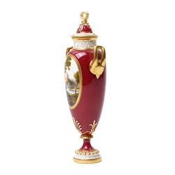 Early 20th century Royal Worcester vase and cover by Harry Davis, painted with a distant view of a castle and a couple resting on a red ground, heightened profusely with gilt, shape number 2422, printed marks in green to base, H25cm