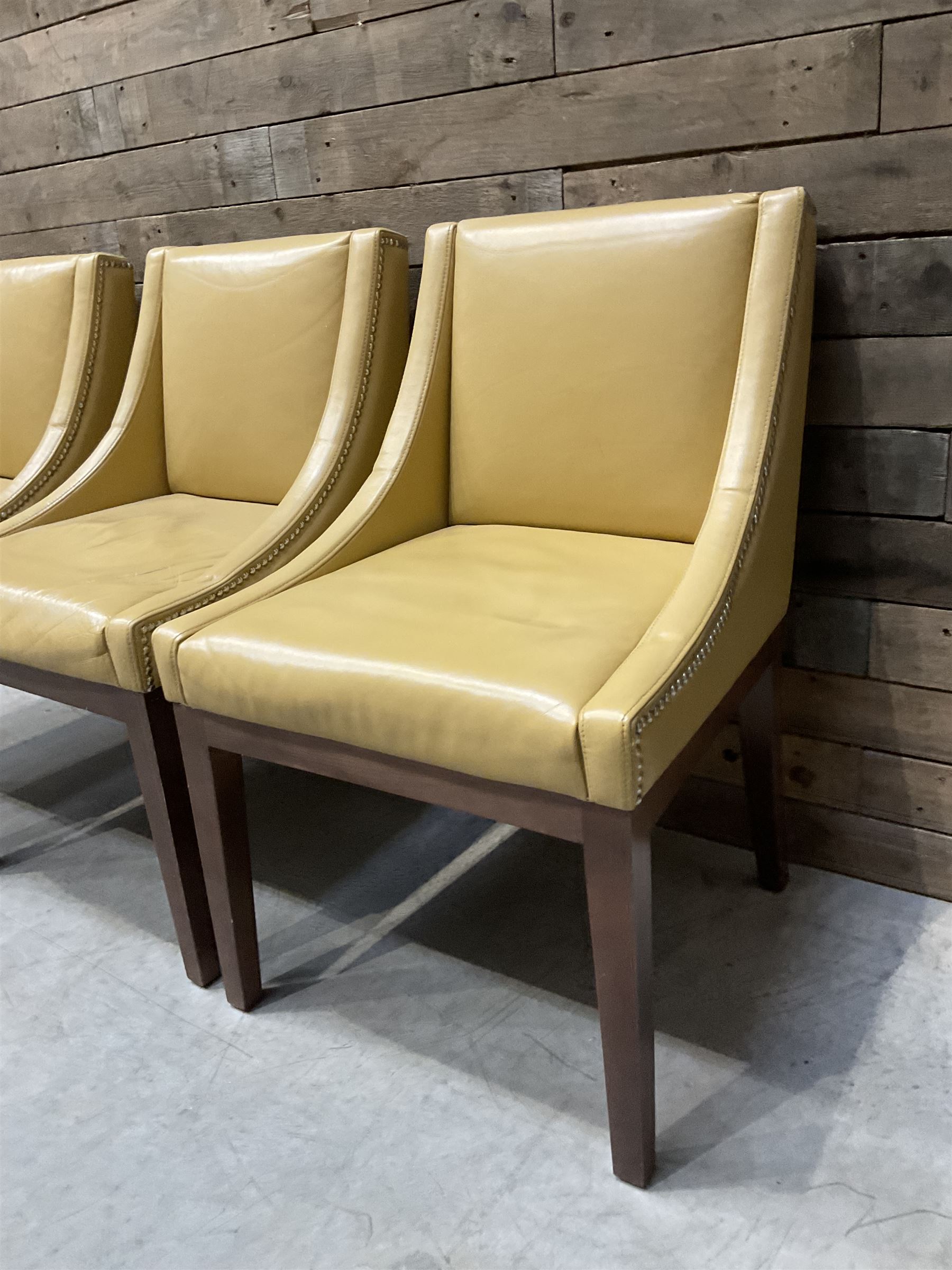 3 x walnut framed dining chairs, upholstered in a dark beige leather