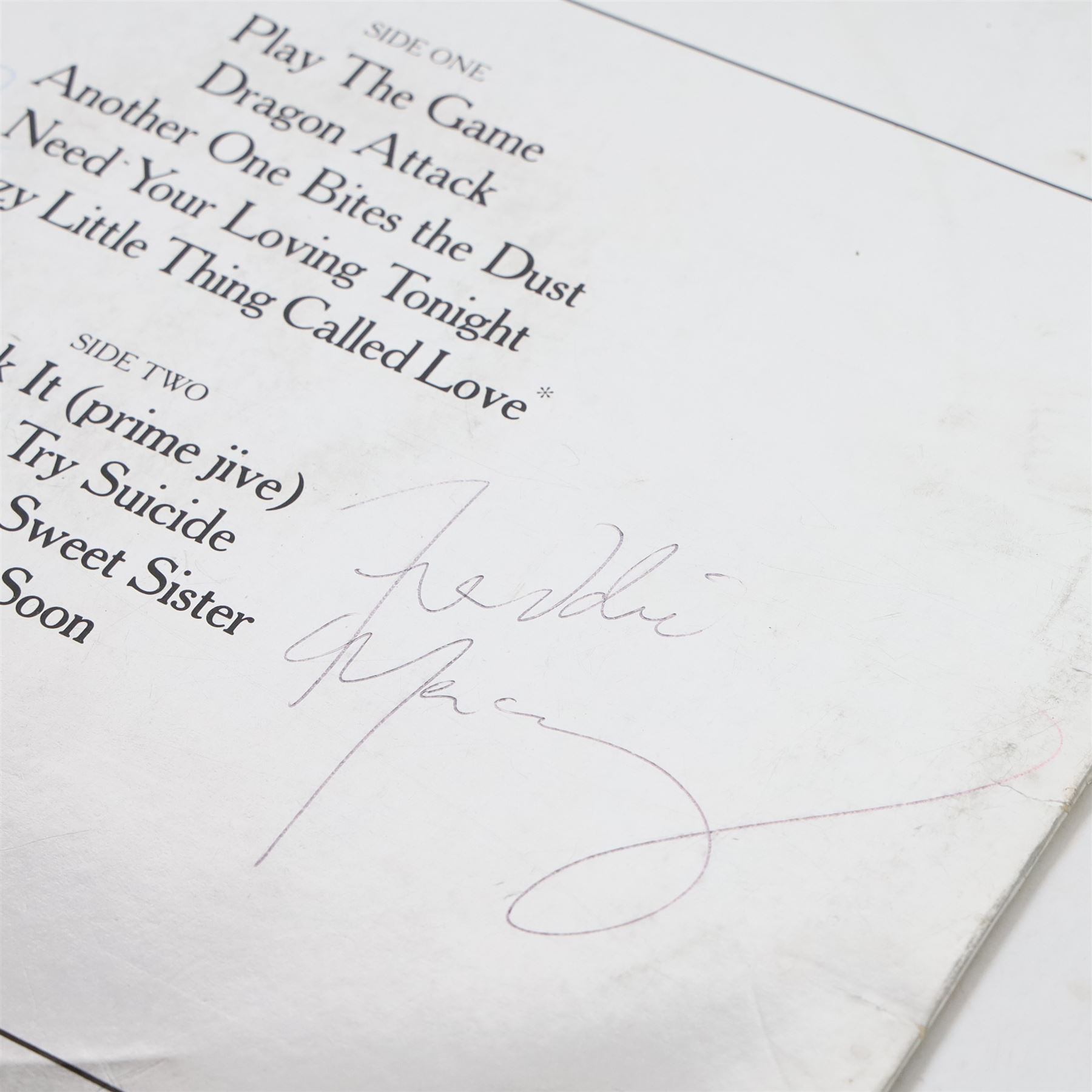 Queen 'The Game' signed vinyl record, signed to the reverse of the mirrored silver sleeve by Freddie Mercury, Roger Taylor and John Deacon, released by EMI records 1980

Provenance by vendor repute: Queen played at Elland Road in Leeds 29th May 1982; the vendor met the band the day before and had this record signed by the three members, but Brian May had not yet got off the train. The vendor called up the hotel and impersonated the band's then manager, Gerry Stickles, (by putting on an Australian accent!) to ask what time the band were arriving, then waited for them at the hotel.