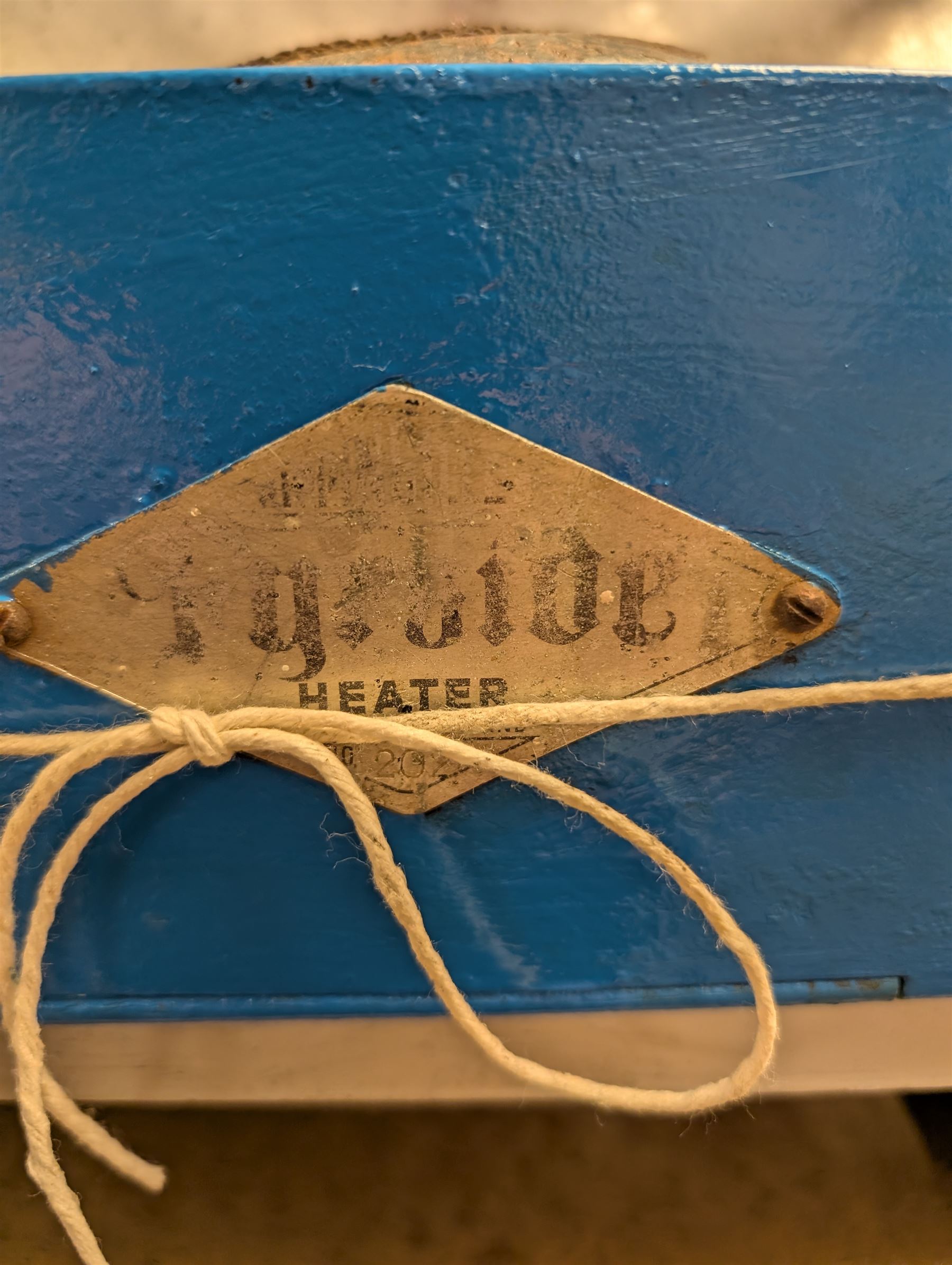 Mid 20th century Rippingilles Fyrside heater, painted in blue and white finish, with two empty glass paraffin bottles