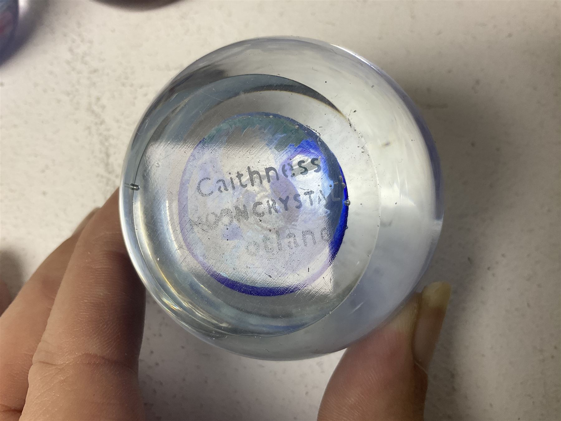 Twelve Caithness glass paperweights, to include Pastel, Mooncrystal and Fiesta, together with Baccarat 'The Princess Anne' paperweight and two Mdina examples (15)