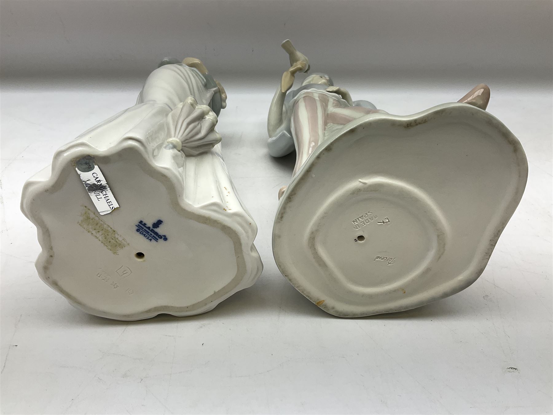 Lladro 'Walk With the Dog' figure no. 4893, together with Lladro swan figure, Porceval figure of a gentleman with a bird perched upon his hand and a further of a lady with flowers beside a basket, all with marks beneath, tallest H40cm