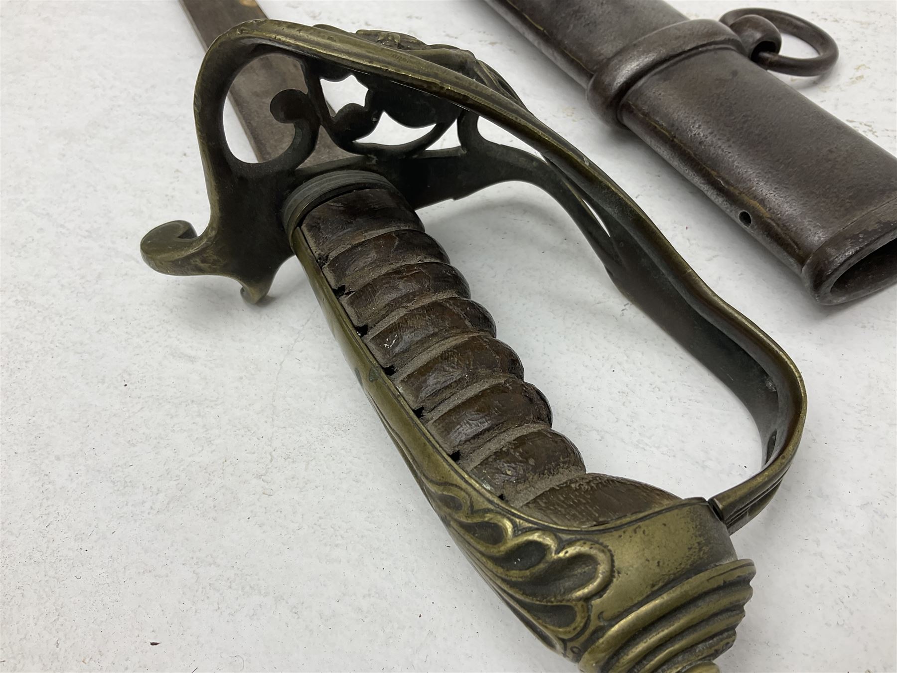 19th century Imperial German army heavy cavalry officers sword by Schnitzler and Kirschbaum, with 89cm single fullered steel blade and sheet steel basket hilt with teardrop cut-out and wire-bound leather grip L107.5cm overall; in steel scabbard with two suspension rings; and British Army 1822 Pattern Infantry Officer's sword in associated scabbard (2)