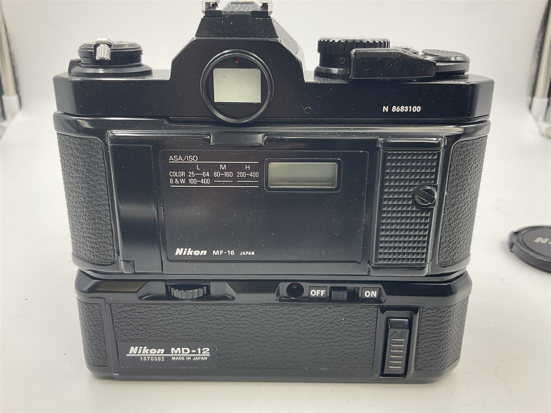 Nikon FM2n camera body, serial no. N8683100, with 'Nikon Zoom-NIKKOR 35-70mm 1:3.3-4.5' len, serial no. 2236565, Nikon MF-16 data back, serial no. 212905 and Nikon MD-12 Motor Drive, serial no 1570382 