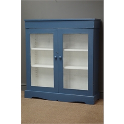  Early 20th century side cabinet, two doors with wire mesh fronts enclosing two adjustable shelves on shaped plinth base, W104cm, H115cm, D33cm  