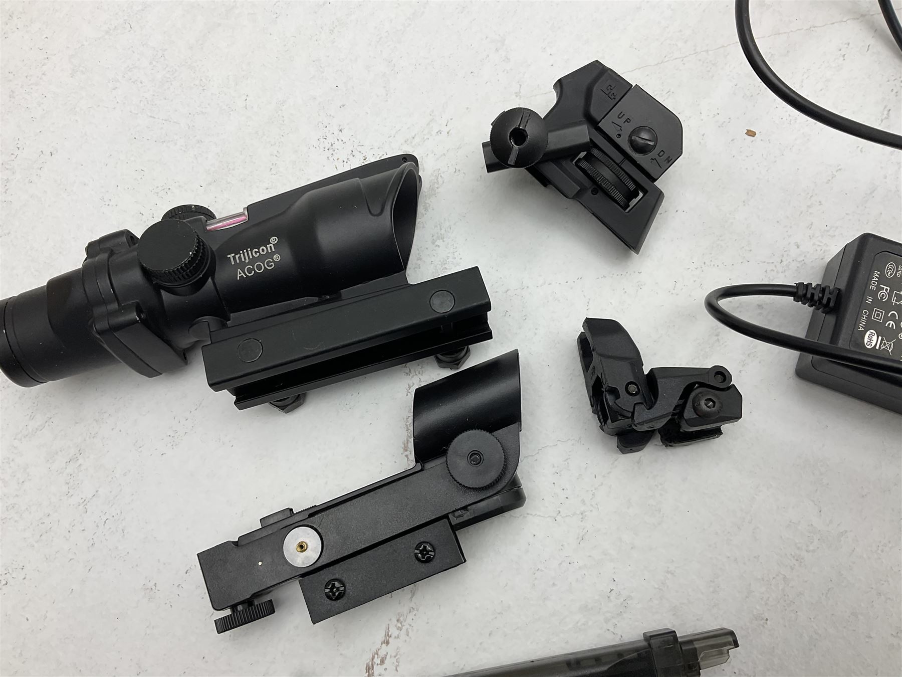 Combat Machine lithium battery powered airsoft BB rifle, 'Complete AEG Series' to fire 5mm pellets, with adjustable length stock L69cm non-extended; with six magazines, Trijicon ACOG red dot telescopic sight, battery charger etc (NO BATTERIES)