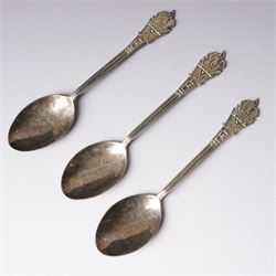 George III silver cream jug with crimped rim and scroll handle, Victorian silver cream jug with embossed decoration Birmingham 1888 and three silver golf spoons Birmingham 1961