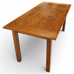 Late 20th century Mackintosh style oak dining table, rectangular top with broad plank surface over shaped frieze with twin pierced oval apertures, raised on square section supports
