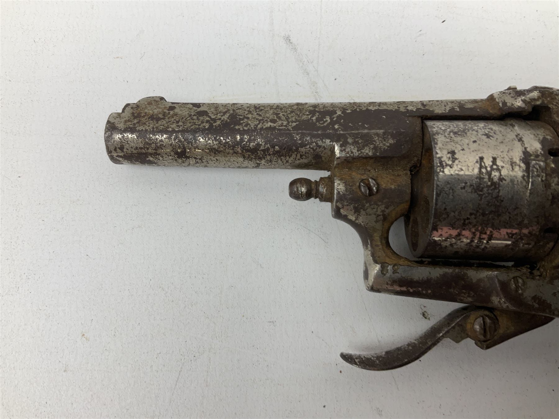 19th century 7mm six-shot pin-fire revolver, with folding trigger, two-piece ebonised grip and ejector rod in butt L17cm