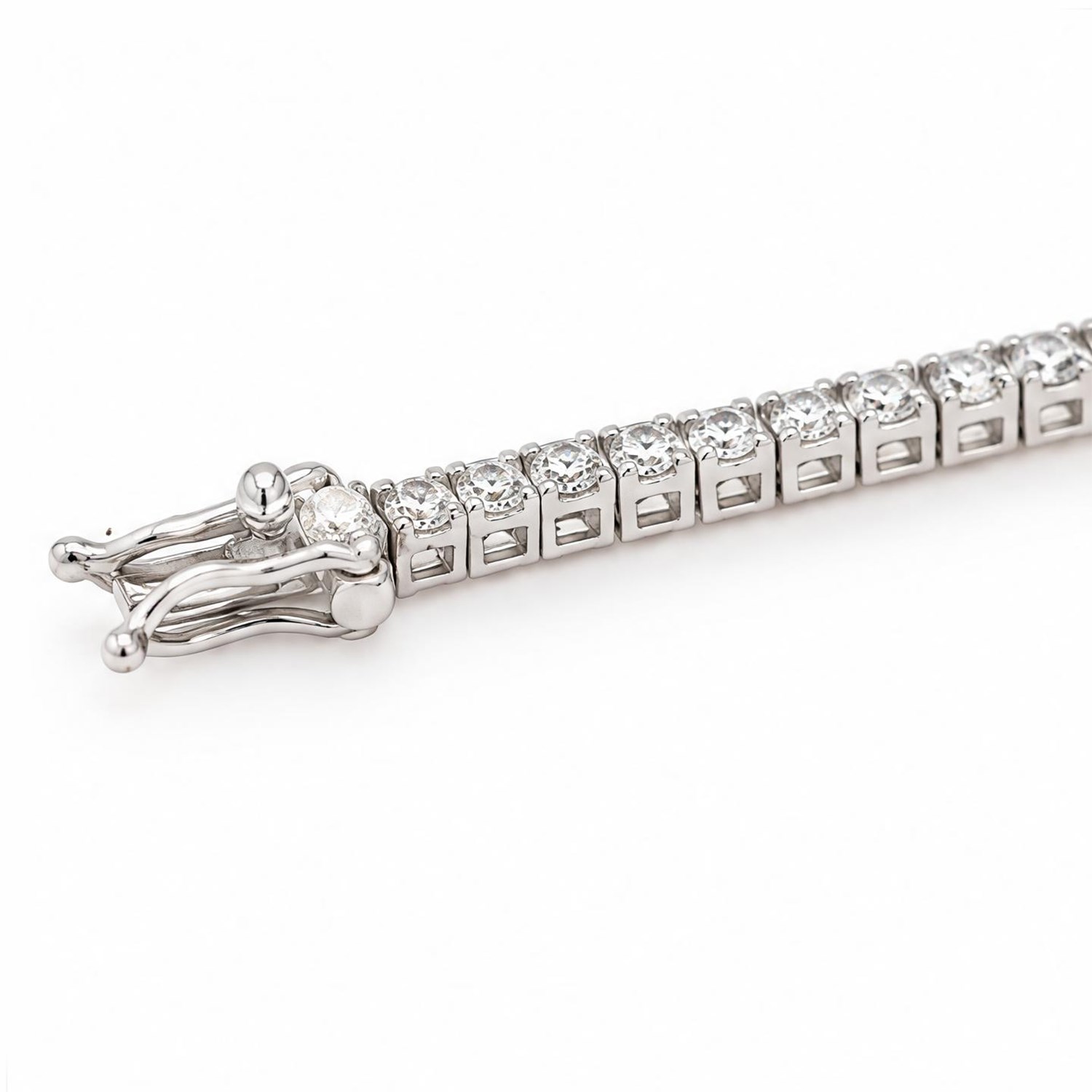 18ct white gold diamond line bracelet, set with seventy-six round brilliant cut diamonds, stamped, total diamond weight approx 2.30 carat