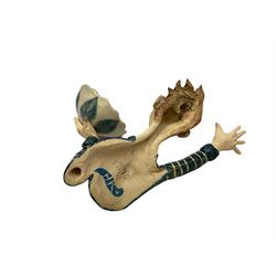 Ceramic 'girl and boy dish', by Helen Kemp, an oval dish with a mottled pink ground and gilt edging upon the sculpted heads of a girl and a boy, together with a 'boy sconce', by Helen Kemp, a sculpted boy holding a small bowl with foliate decoration, both with the artist's mark beneath.