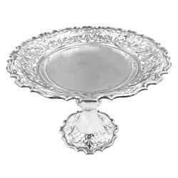Edwardian silver pedestal dish, the bowl of circular form, with shaped rim and pierced foliate and scroll sides, upon a knopped stem and spreading circular foot, with conforming pierced decoration, hallmarked Walker & Hall, Sheffield 1909, H18.5cm
