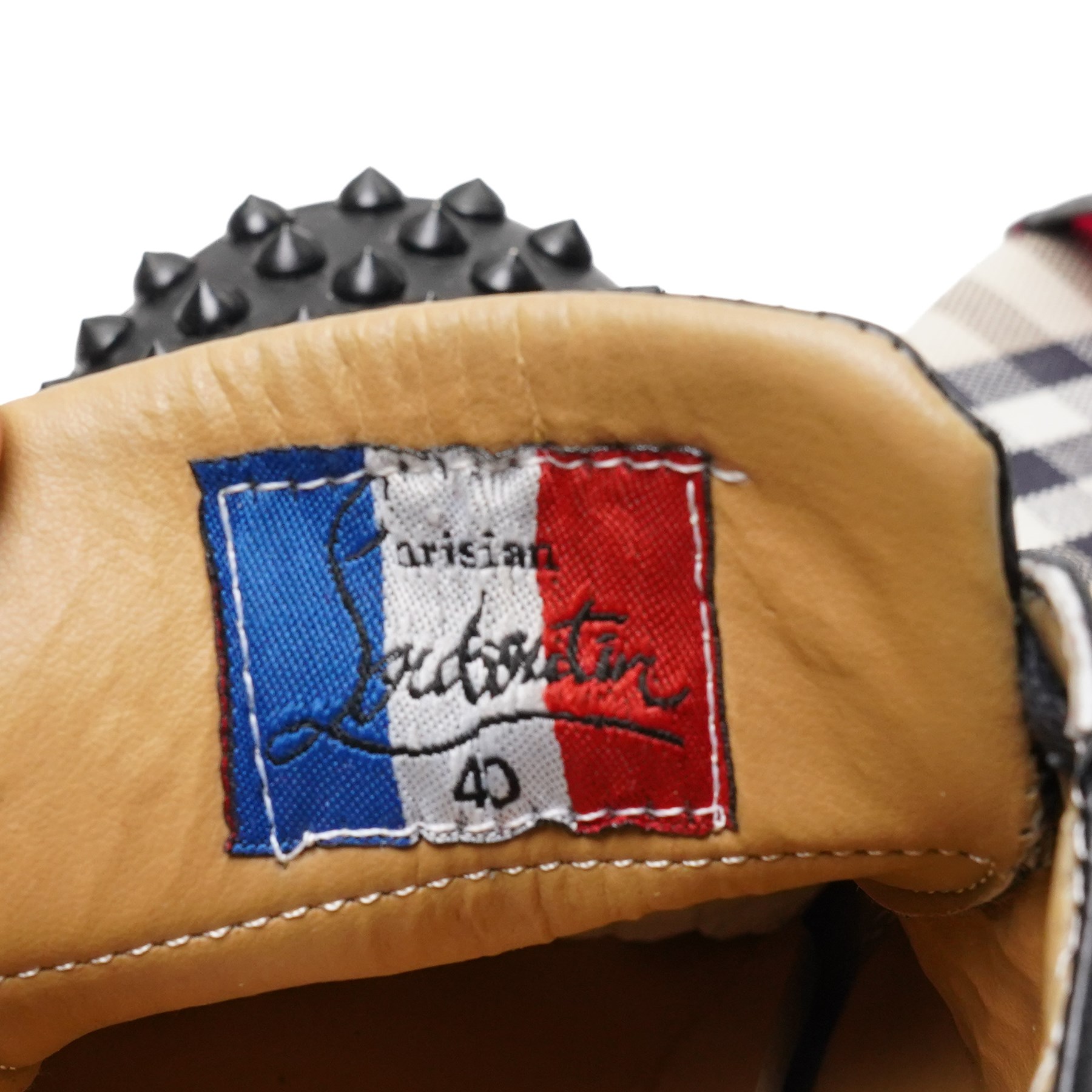 Christian Louboutin and Burberry - two pairs of designer shoes, comprising black leather Christian Louboutin low-top sneakers with black spike-studded toe caps and signature red soles, size 40, with dust bag, together with Burberry check canvas and red transparent strap sandals, size 39, with box and dust bag (2)