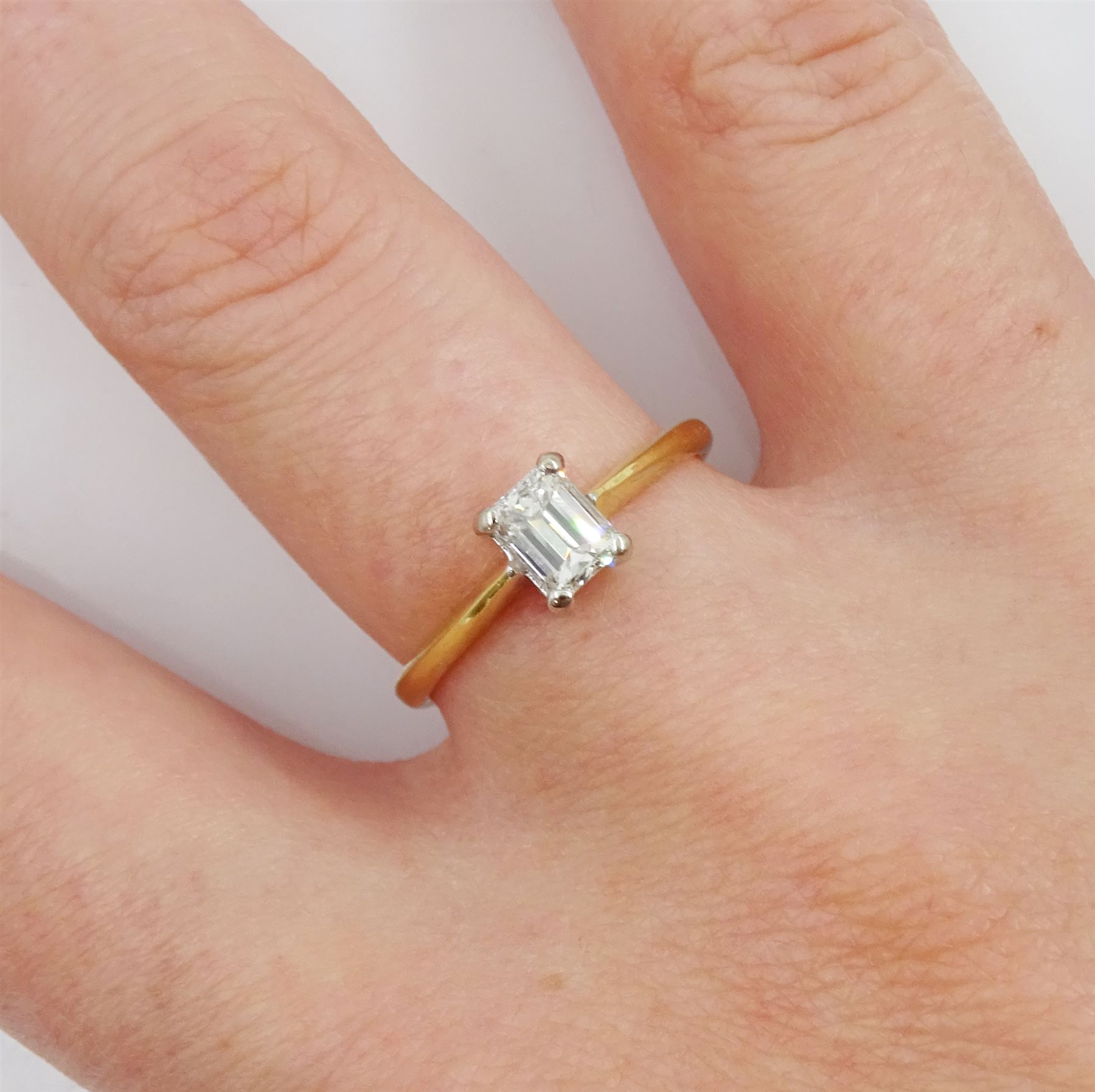 18ct gold single stone emerald cut diamond ring, London 2000, diamond approx 0.50 carat