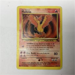 Collection of Pokemon trading cards, mostly 1999 Wizards Pokemon cards to include holo Charizard 4/102, first edition holo Machamp 8/102, further holographic cards; Dark Flareon 35/82 and Dark Vaporeon 45/82, cards from themed sets and 4th edition prints; 1998 Electronic Pokédex with cardboard boxes for themed decks Blackout, Overgrowth and Power Reserve Jungle, along with a large quantity of energy and trainer cards 