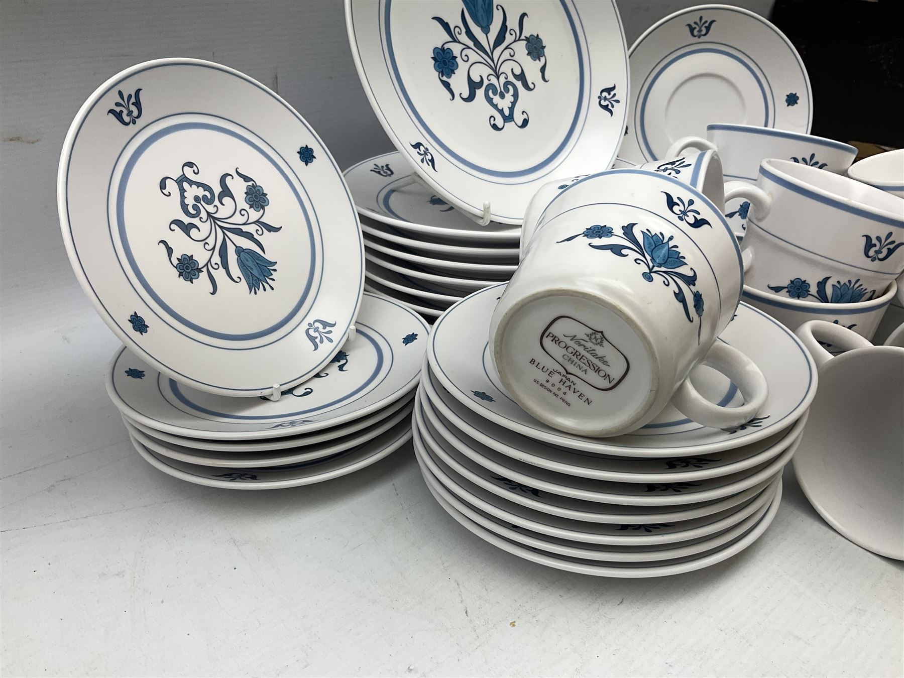 Royal Worcester Evesham pattern teawares, Noritake part tea service decorated in the 'Progression Blue Haven' pattern, together with Seltmann Weiden Bavaria tea and dinner wares, and two blue and white platters