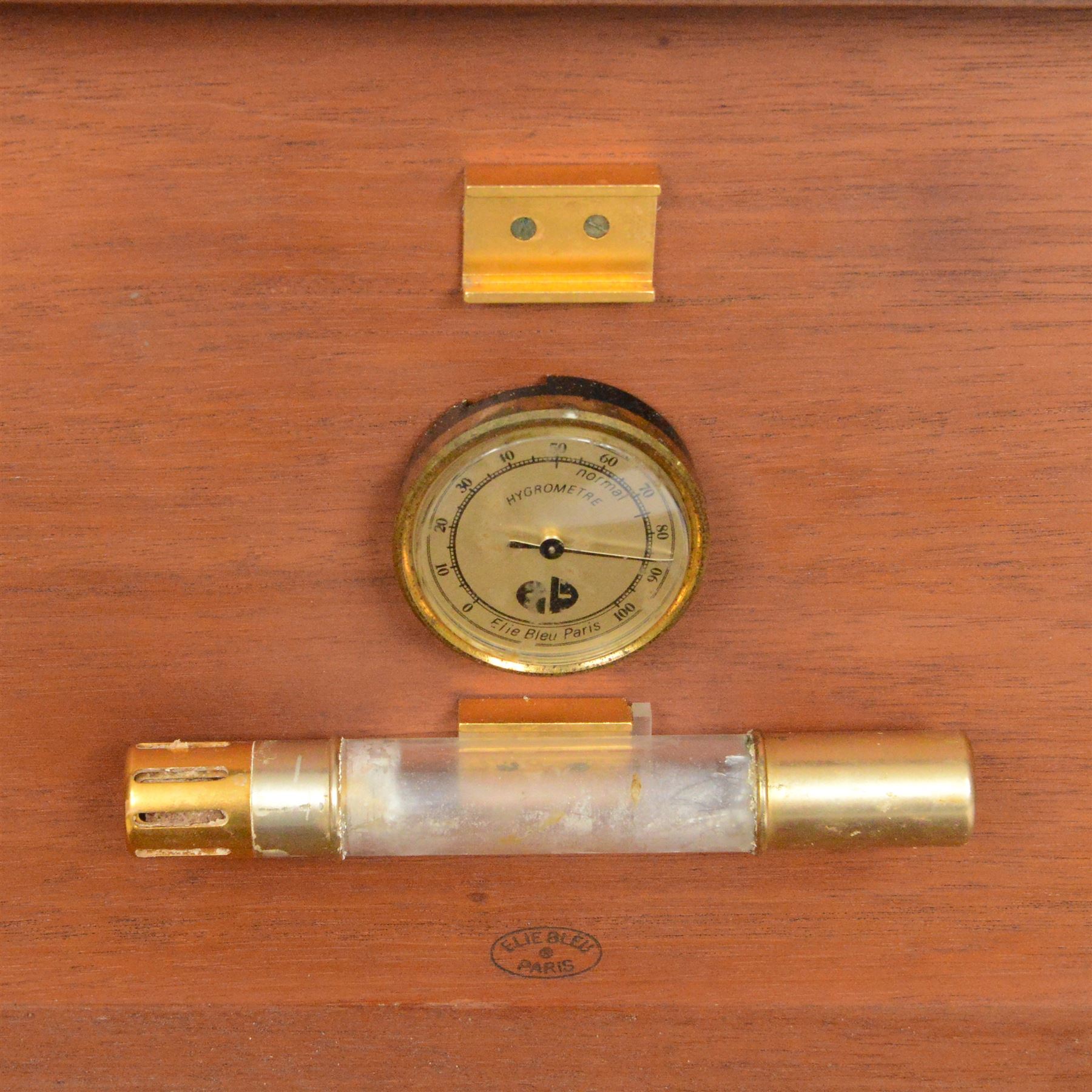 Elie Bleu of Paris, mahogany humidor with partitioned interior and inset hygrometer, together with two cigar cases and The Cigar Companion book