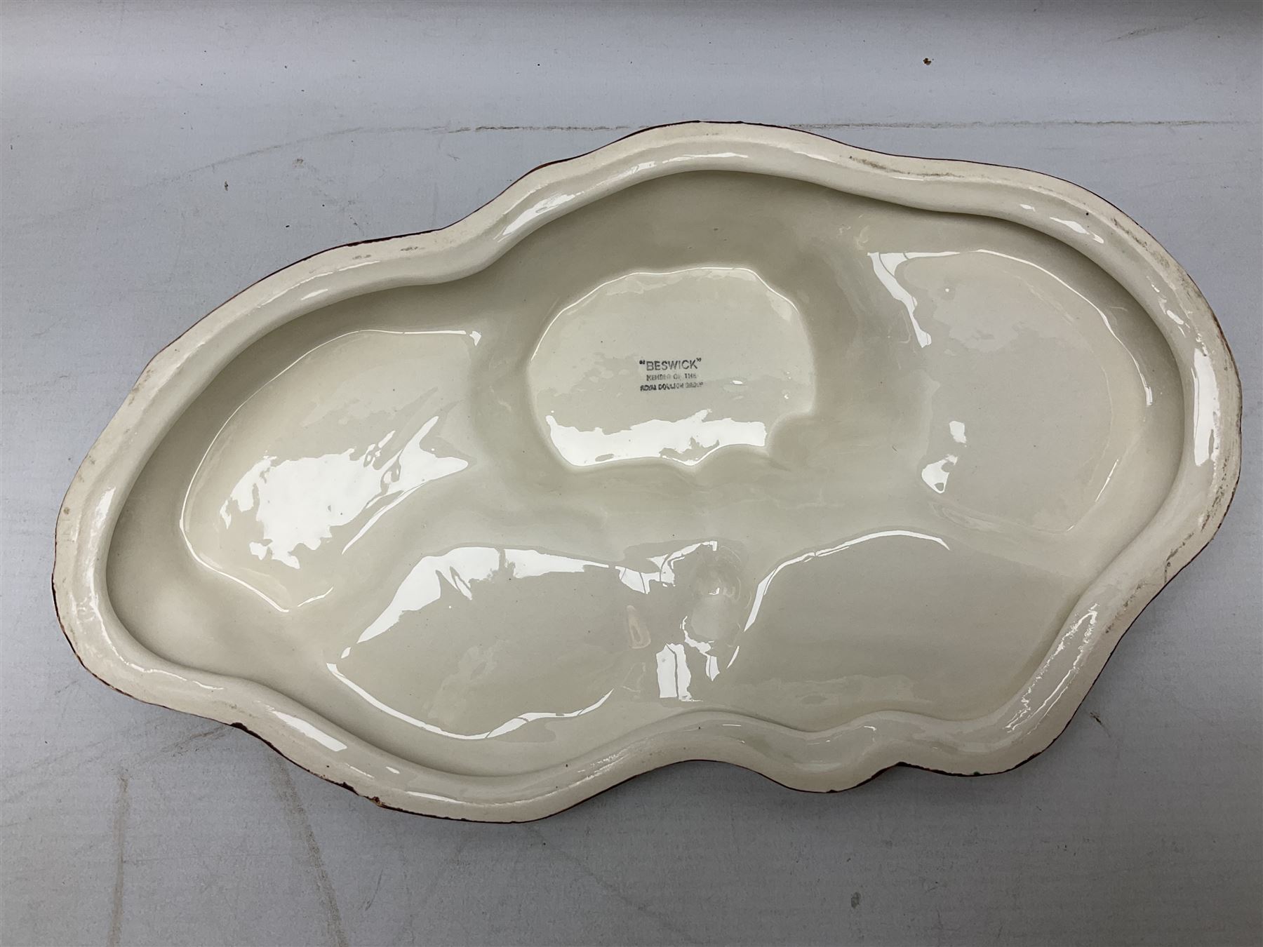 Seven Beswick Beatrix Potter figures, comprising Sally Henny Penny, Johnny Town-Mouse, Mrs Tiggy-Winkle, Mrs Tittlemouse, Tom Kitten, Pig-Wig and Squirrel Nutkin, together with a Beswick tree trunk display stand, stand L30cm