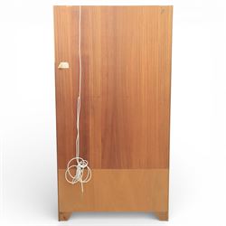 Nathan - teak wall unit, the arched open display recess above a glazed cabinet enclosed by two cupboard doors fitted with internal shelving, the lower section with a recessed serving surface over a pair of signature square panelled cupboard, raised on an integrated plinth base