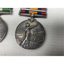 Boer War pair of medals comprising Queens South Africa Medal with two clasps for Paardeberg and Relief of Kimberley and Kings South Africa Medal with two clasps for South Africa 1901 & 1902, awarded to 9752 Dvr. T. Finan A.S.C. with ribbons (2)