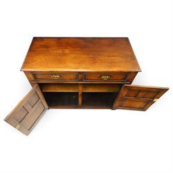 18th century style oak dresser base, rectangular moulded top over two frieze drawers with brass handles, twin panelled cupboard doors below with pierced brass escutcheons, on stile feet