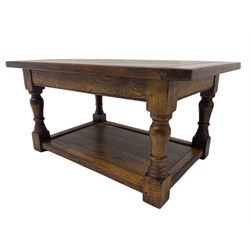 Traditional oak two tier coffee table, turned supports united by under-tier