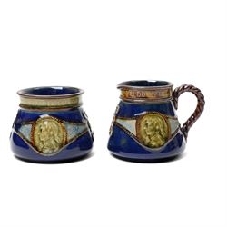 Royal Doulton stoneware Lord Nelson commemorative three piece tea set modelled in low relief with Victory and Nelson portrait with rope twist handles height of tea pot 13cm, Copeland late Spode coffee pot with relief moulded decoration and a similar jug