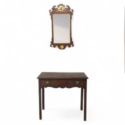 George III mahogany side table, the rectangular moulded top above a single frieze drawer fitted with brass swan neck handles, above a shaped serpentine apron raised upon square section legs, W86 D42 H75cm, together with a George III fretwork mirror, the rectangular plate within a gilt slip surmounted by a pierced crest with inset carved Ho-Ho bird, with shaped apron with gilt shell motif, H84cm W45cm
