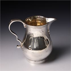 Four piece silver tea and coffee service of baluster form, the tea and coffee pots with domed covers and stained handles London 1916-1918, Maker  C S Harris & Sons Ltd