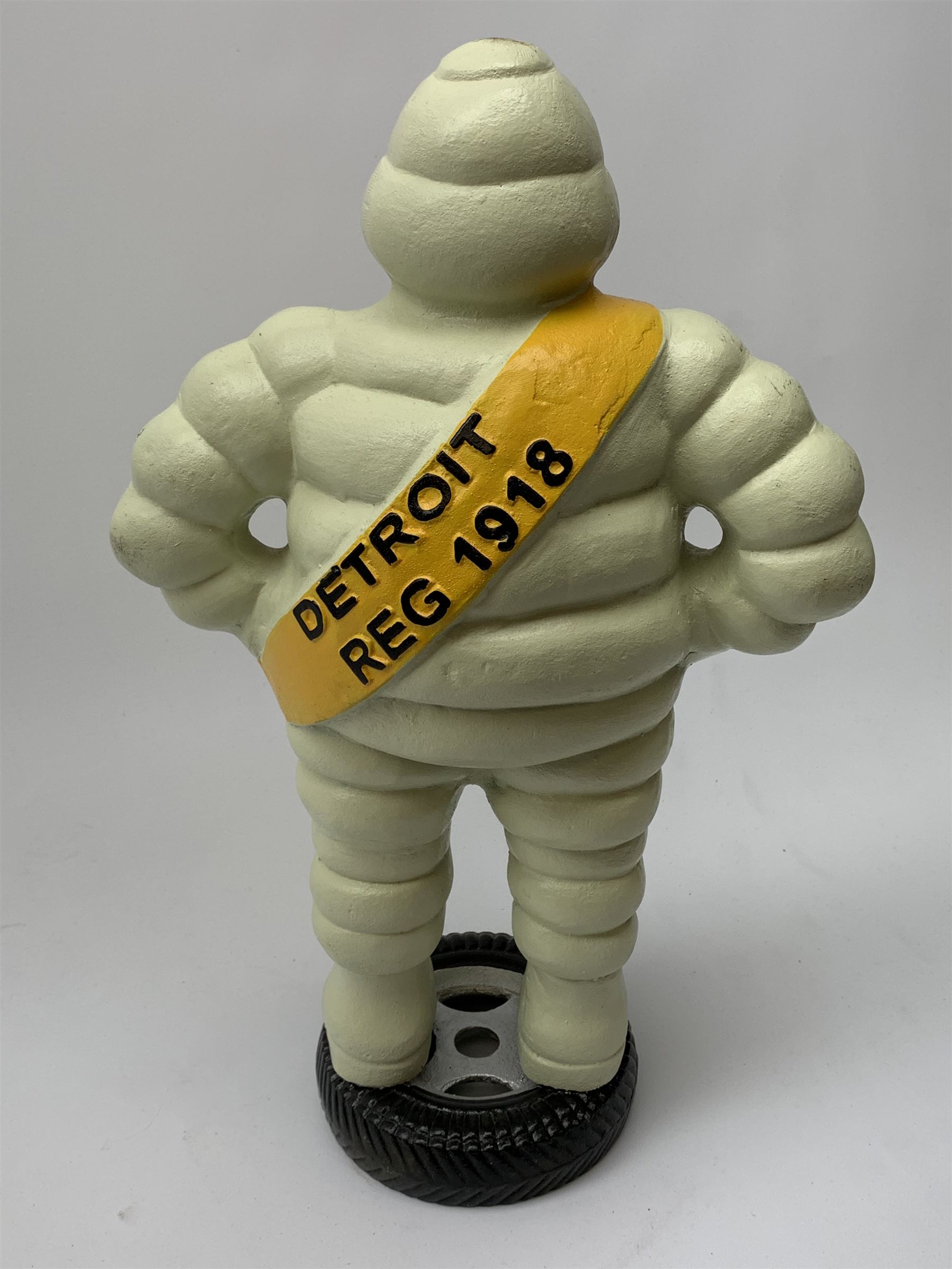 A cast iron Michelin man type figure, H40cm.