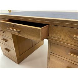 20th century vintage oak twin pedestal desk, leather inset top above three long drawers, pedestal supports each have three long graduating drawers 