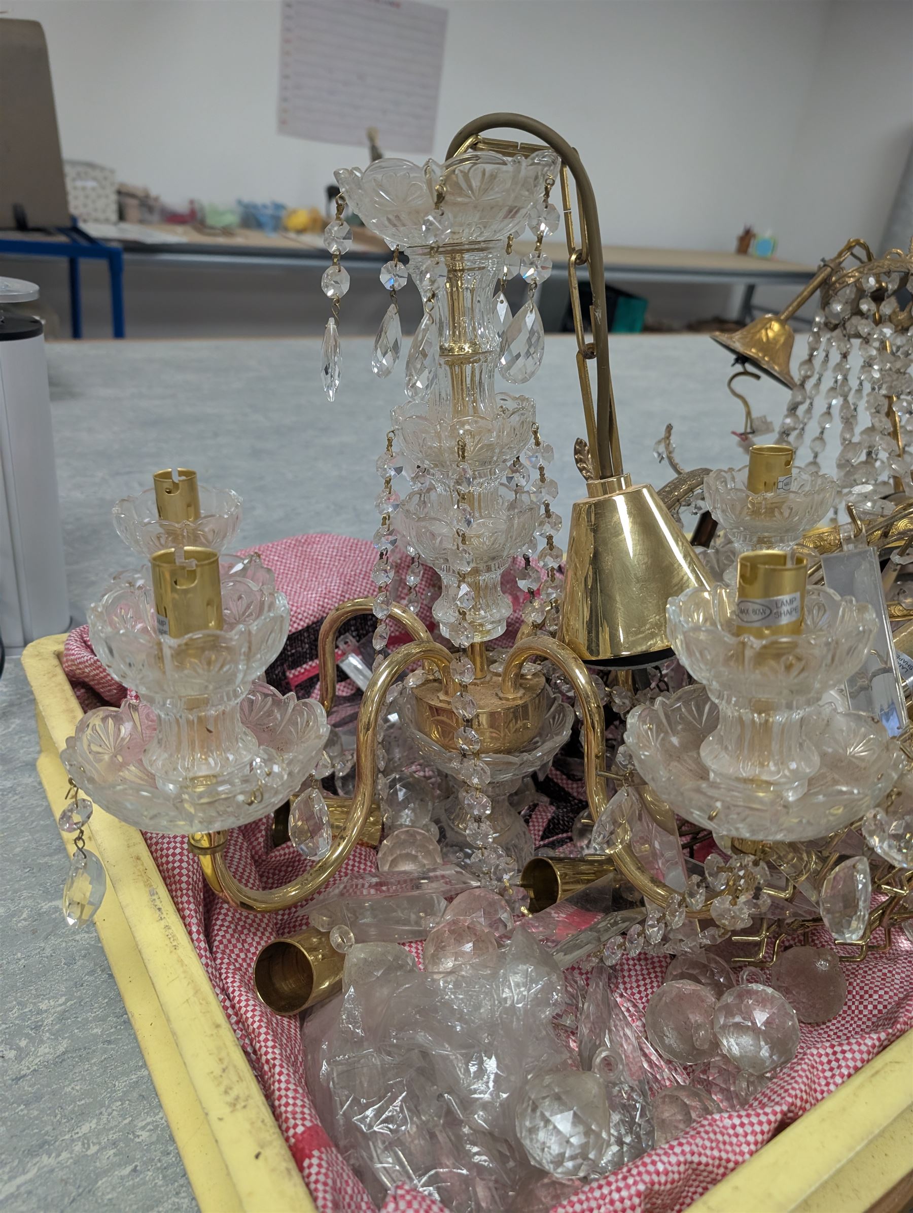 Four brass and glass chandelier light fittings