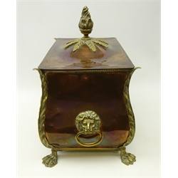  Victorian copper and brass bombe shape coal box, the cover with flame finial, twin lion mask handles and on raised lion paw feet, L43cm x H47cm   
