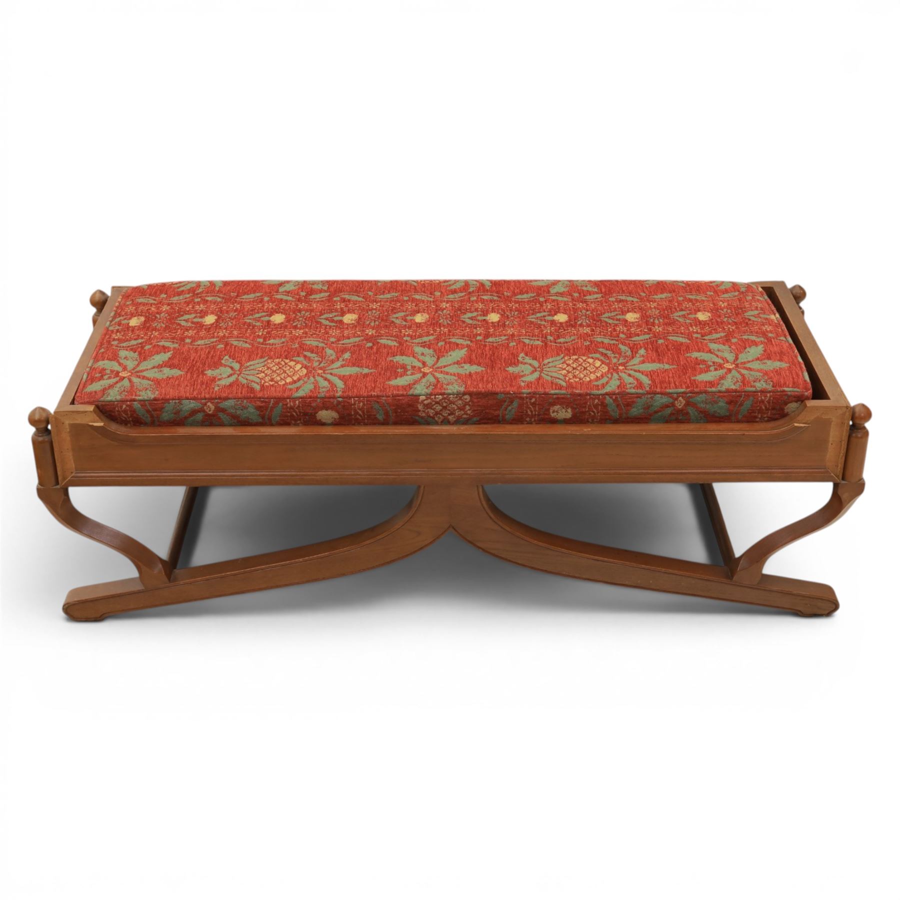 Traditional design teak long foot stool, red patterned seat cushion, on an X-frame base