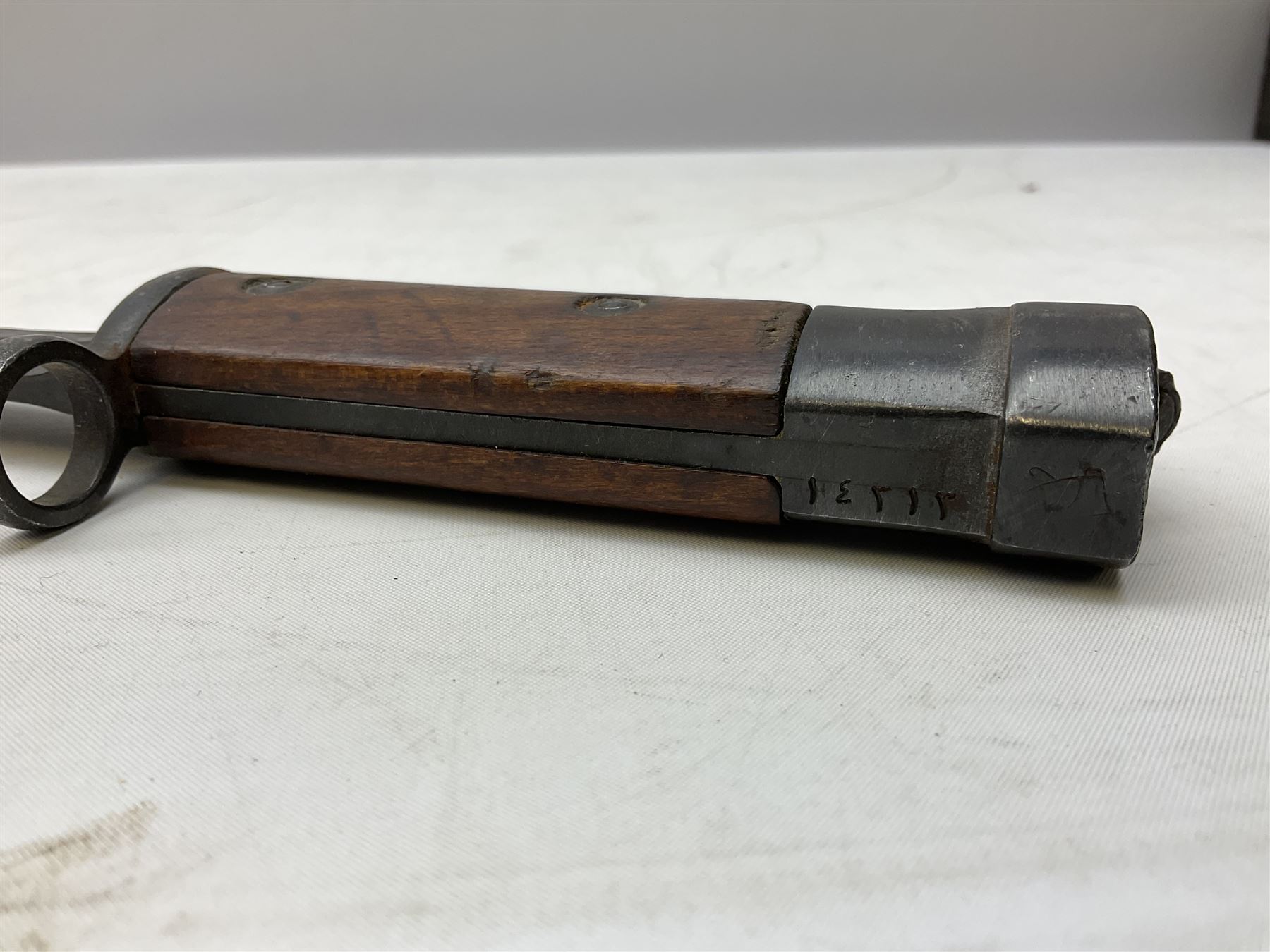 Swiss Model 1957 SIG rifle bayonet by Wenger with 23.5cm steel blade numbered 350857; in plastic scabbard with leather frog stamped GSCH 85 L38cm overall; and Egyptian Hakim rifle bayonet with the same script number to the grip and steel scabbard (2)