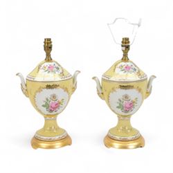 Pair of urn table lamps, decorated with central panels of floral sprigs upon a yellow grou...