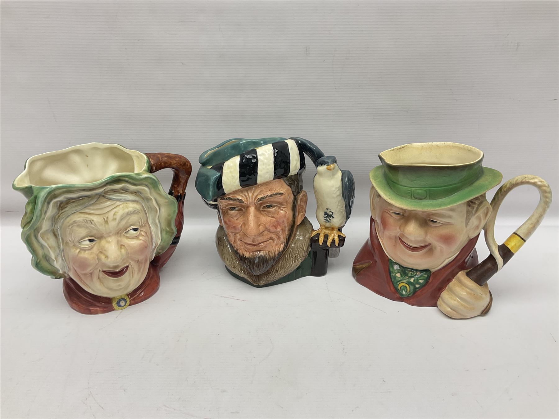 Collection of Royal Doulton and Beswick character jugs of various sizes, including North American Indian D6611, The Falconer D6533,  Tony Weller 281, Sairey Gamp 371 etc