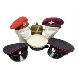 Five military caps/berets comprising two peaked caps with 'Yorkshire' and 'Royal Engineers' badges; maroon beret with parachute regiment badge; red beret with Military Police badge; and AB seaman hat with HM Submarines band; and a felt and webbing covered water bottle (6)